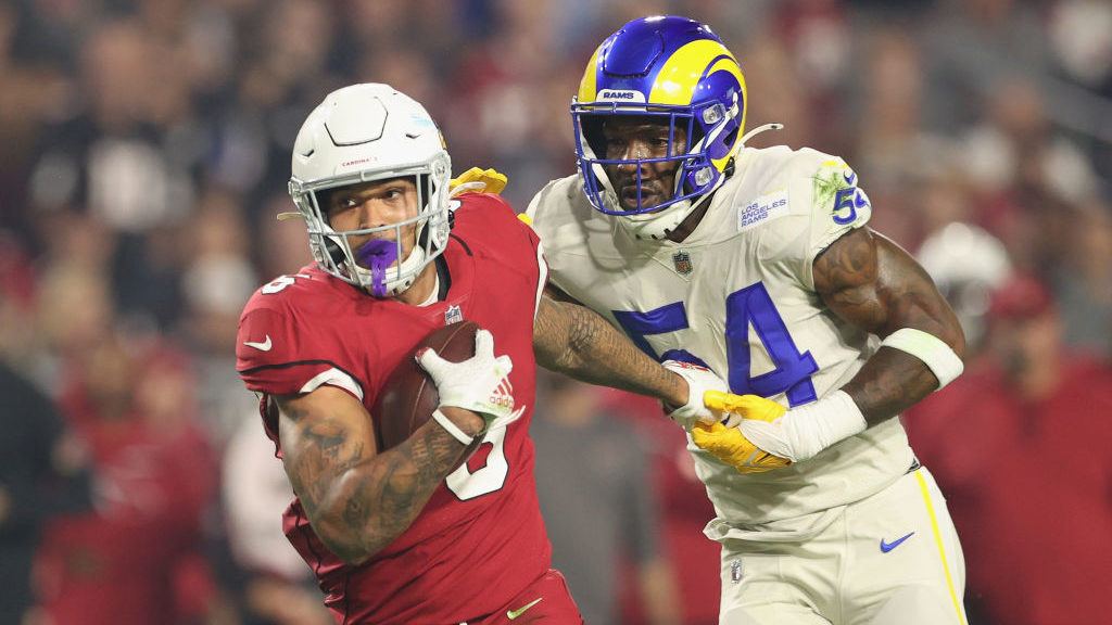 Running back James Conner #6 of the Arizona Cardinals rushes the football against Leonard Floyd #54...