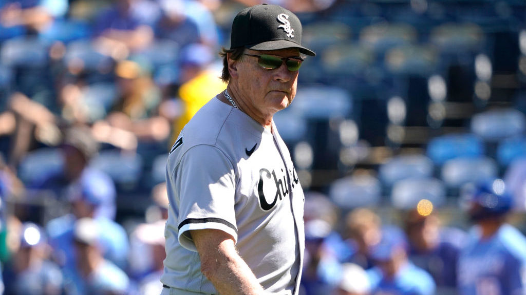 Manager Tony La Russa #22 of the Chicago White Sox walks off the field after making a visit to the ...