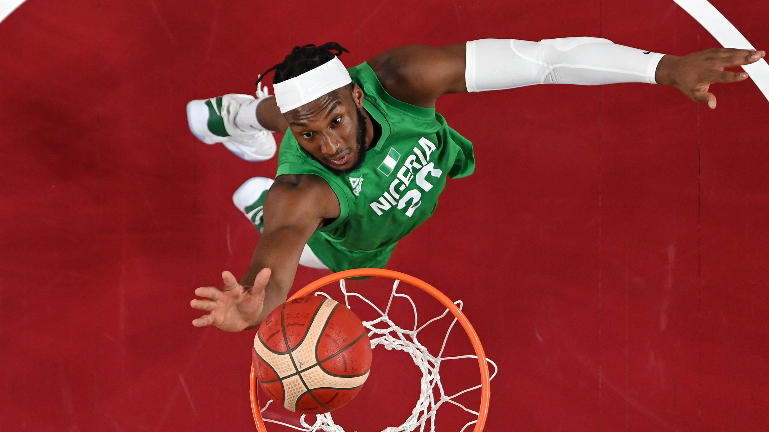 Josh Okogie #20 of Team Nigeria goes up for a shot against Italy during the first half of a Men's B...