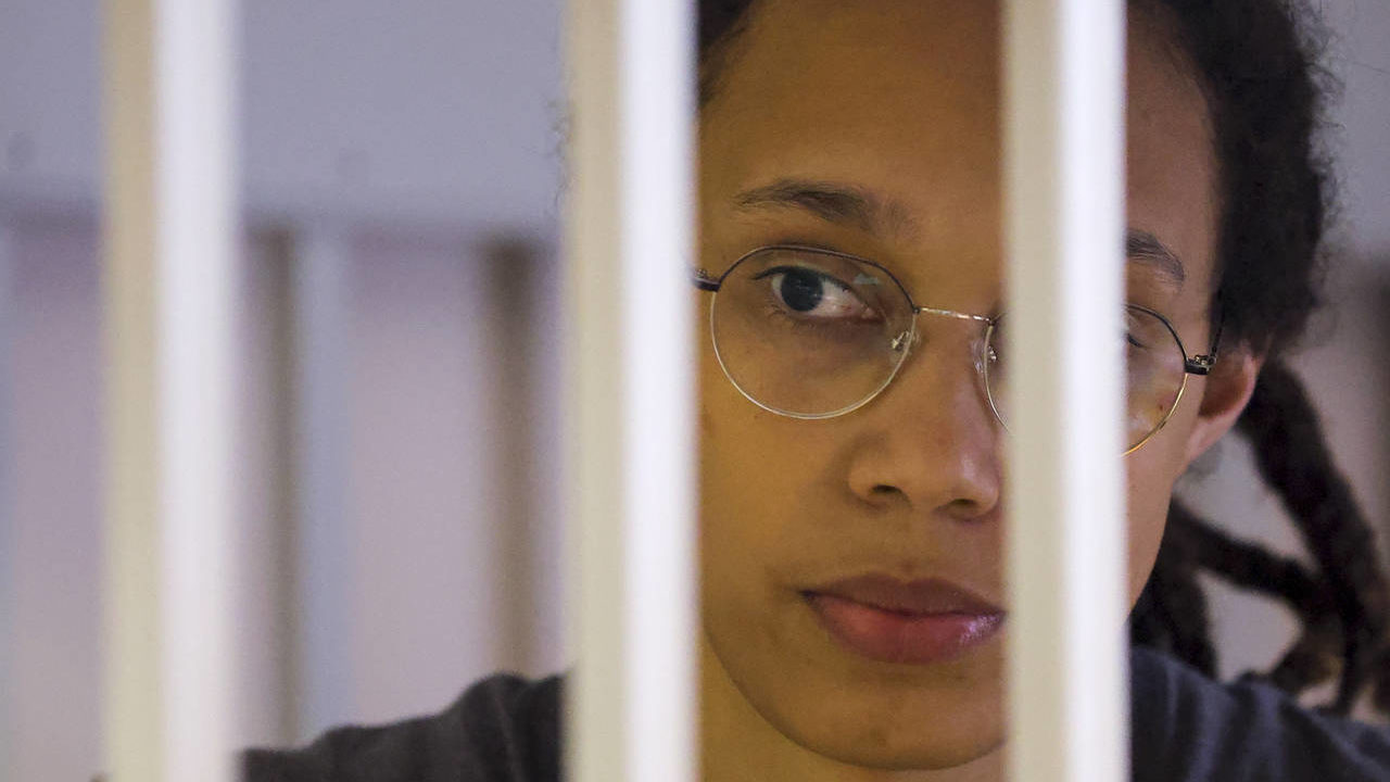 WNBA star and two-time Olympic gold medalist Brittney Griner looks through bars as she listens to t...