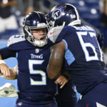 Tennessee Titans quarterback Logan Woodside (5) celebrates with Xavier Newman (67) after Woodside scored a touchdown against the Arizona Cardinals in the second half of a preseason NFL football game Saturday, Aug. 27, 2022, in Nashville, Tenn. (AP Photo/Mark Zaleski)