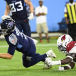 Tennessee Titans quarterback Logan Woodside (5) dives past Arizona Cardinals safety Tae Daley (48) to score a touchdown in the second half of a preseason NFL football game Saturday, Aug. 27, 2022, in Nashville, Tenn. (AP Photo/Mark Zaleski)