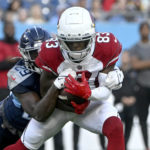 Arizona Cardinals wide receiver Greg Dortch (83) catches a pass as he is defended by Tennessee Titans safety Theo Jackson (29) in the first half of a preseason NFL football game Saturday, Aug. 27, 2022, in Nashville, Tenn. (AP Photo/John Amis)