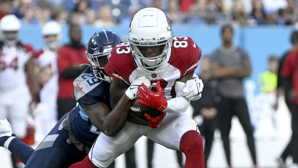 Arizona Cardinals wide receiver Greg Dortch (83) catches a pass as he is defended by Tennessee Tita...
