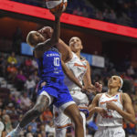 Phoenix Mercury guard Diana Taurasi (3) fouls Connecticut Sun guard Courtney Williams (10) during a WNBA basketball game Tuesday, Aug. 2, 2022, in Uncasville, Conn. (Sean D. Elliot/The Day via AP)