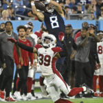 Tennessee Titans wide receiver Cody Hollister (8) makes a catch over Arizona Cardinals cornerback Jace Whittaker (39) in the second half of a preseason NFL football game Saturday, Aug. 27, 2022, in Nashville, Tenn. (AP Photo/John Amis)
