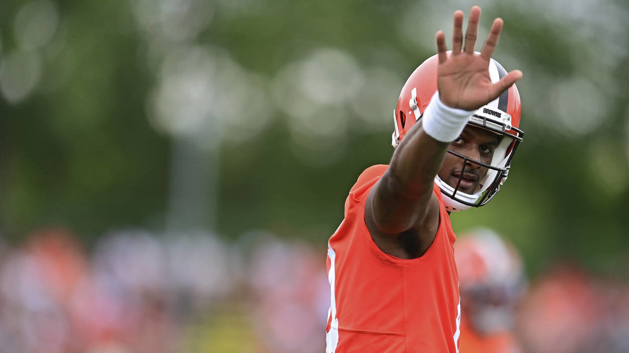 Cleveland Browns quarterback Deshaun Watson waves to fans during an NFL football practice in Berea,...