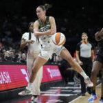 
              Seattle Storm forward Stephanie Talbot (7) keeps the ball in bounds against Las Vegas Aces guard Jackie Young (0) during the first half in Game 2 of a WNBA basketball semifinal playoff series Wednesday, Aug. 31, 2022, in Las Vegas. (AP Photo/John Locher)
            