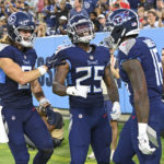 Tennessee Titans wide receiver Treylon Burks (16) celebrates with Cody Hollister, left, and Hassan Haskins (25) after Burks scored a touchdown against the Arizona Cardinals in the first half of a preseason NFL football game Saturday, Aug. 27, 2022, in Nashville, Tenn. (AP Photo/Mark Zaleski)