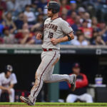 Arizona Diamondbacks' Carson Kelly scores on a two-run double by Alek Thomas during the fifth inning of the team's baseball game against the Cleveland Guardians, Tuesday, Aug. 2, 2022, in Cleveland. (AP Photo/David Dermer)