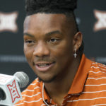 
              FILE - Texas running back Bijan Robinson speaks at the NCAA college football Big 12 media days in Arlington, Texas, Thursday, July 14, 2022. At Texas, running back Bijan Robinson has deals with Raising Cane's restaurants, C4 Energy drinks and sports streaming platform DAZN, while also forging a partnership with an auto dealership for the use of a Lamborghini. (AP Photo/LM Otero, File)
            