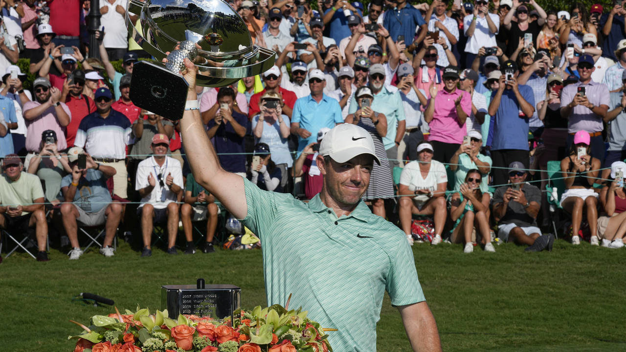 Rory McIlroy, of Northern Ireland, celebrates his victory during the final round of the Tour Champi...
