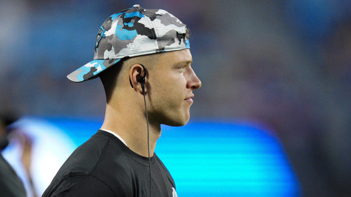 Carolina Panthers running back Christian McCaffrey watches during the first half of an NFL preseaso...
