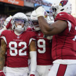 Arizona Cardinals wide receiver Andre Baccellia (82) celebrates after scoring a touchdown during an NFL football preseason game against the Cincinnati Bengals in Cincinnati, Friday, Aug. 12, 2022. (AP Photo/Jeff Dean)