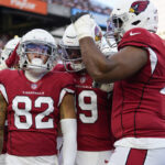 Arizona Cardinals wide receiver Andre Baccellia (82) celebrates after scoring a touchdown during an NFL football preseason game against the Cincinnati Bengals in Cincinnati, Friday, Aug. 12, 2022. (AP Photo/Jeff Dean)