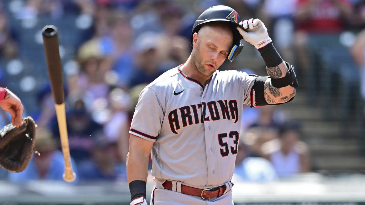 Arizona Diamondbacks' Christian Walker reacts after striking out during the eighth inning of a base...