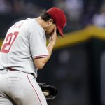 Philadelphia Phillies starting pitcher Aaron Nola pauses on the mound during the fourth inning of the team's baseball game against the Arizona Diamondbacks on Tuesday, Aug. 30, 2022, in Phoenix. (AP Photo/Ross D. Franklin)