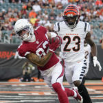 Arizona Cardinals wide receiver Andre Baccellia (82) pulls in a pass for a touchdown in front of Cincinnati Bengals safety Dax Hill (23) during the first half of an NFL football preseason game in Cincinnati, Friday, Aug. 12, 2022. (AP Photo/Jeff Dean)