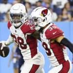 Arizona Cardinals safety James Wiggins (38) celebrates with Jace Whittaker (39) after Wiggins intercepted a pass against the Tennessee Titans in the second half of a preseason NFL football game Saturday, Aug. 27, 2022, in Nashville, Tenn. (AP Photo/Mark Zaleski)