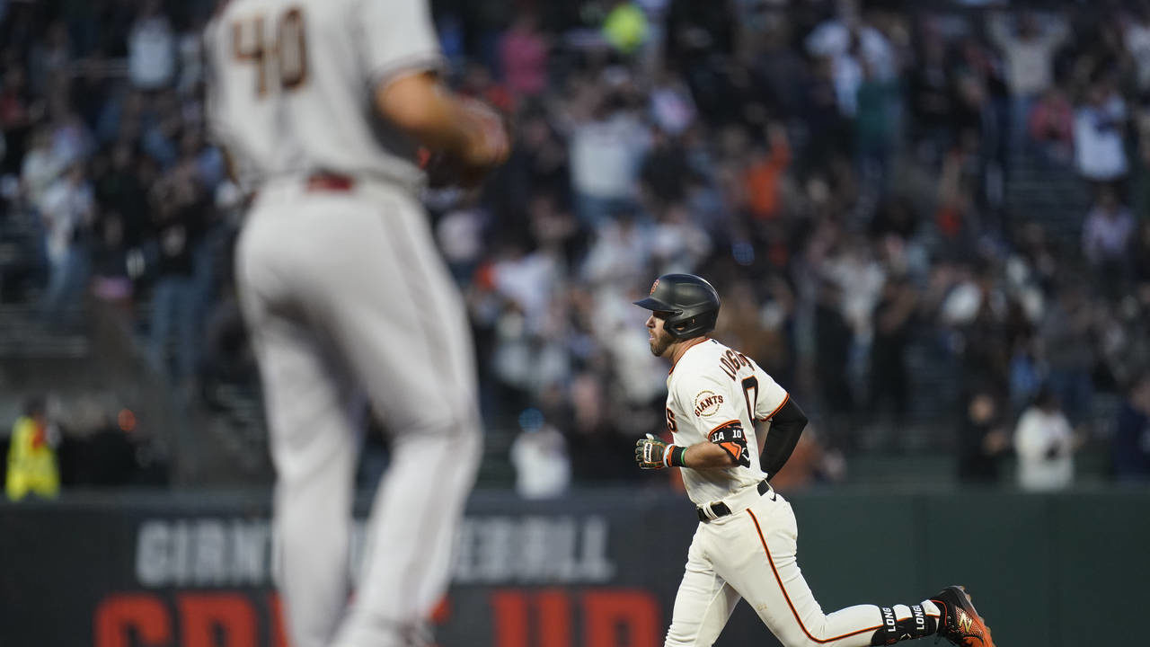 San Francisco Giants' Evan Longoria runs the bases after hitting a two-run home run against the Ari...