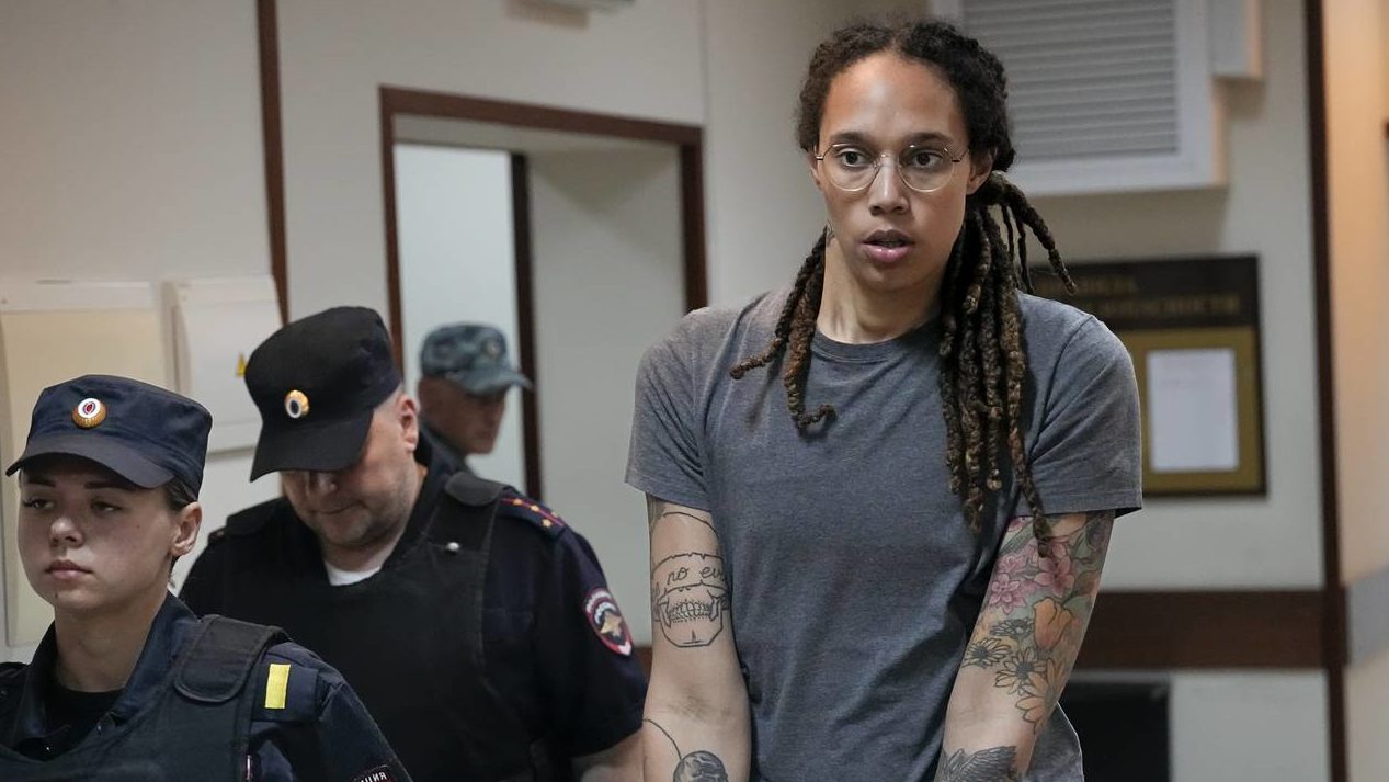 WNBA star and two-time Olympic gold medalist Brittney Griner is escorted from a court room ater a h...