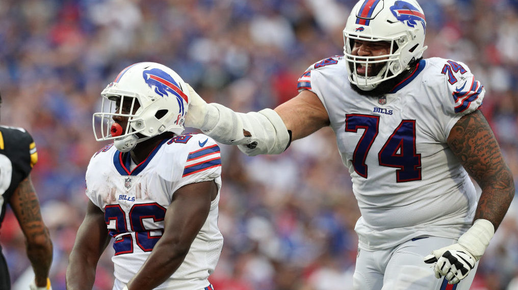 Devin Singletary #26 and Cody Ford #74 of the Buffalo Bills react during the fourth quarter against...