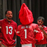 Arizona Cardinals mascot Big Red greets WRs Antoine Wesley and Greg Dortch during a charity event at Adams Elementary on Monday, Sept. 12, 2022, in Mesa. (Tyler Drake/Arizona Sports)