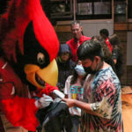 Arizona Cardinals mascot Big Red interacts with an Adams Elementary student on Monday, Sept. 12, 2022, in Mesa. (Tyler Drake/Arizona Sports)