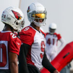 Arizona Cardinals star backer Isaiah Simmons chats with Marco Wilson during practice on Friday, Sept. 23, 2022, in Tempe. (Tyler Drake/Arizona Sports)