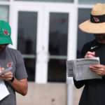 Arizona Cardinals head coach Kliff Kingsbury and co-pass game coordinator/QBs coach Cam Turner talk shop ahead of practice on Friday, Sept. 9, 2022, in Tempe. (Tyler Drake/Arizona Sports)