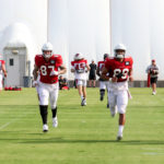 Arizona Cardinals tight ends warm up ahead of practice on Thursday, Sept. 8, 2022, in Tempe. (Tyler Drake/Arizona Sports)