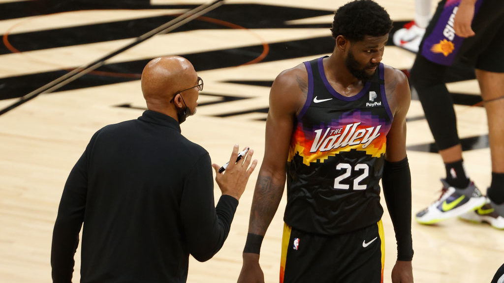 Head coach Monty Williams of the Phoenix Suns talks with Deandre Ayton #22 in the second half of ga...