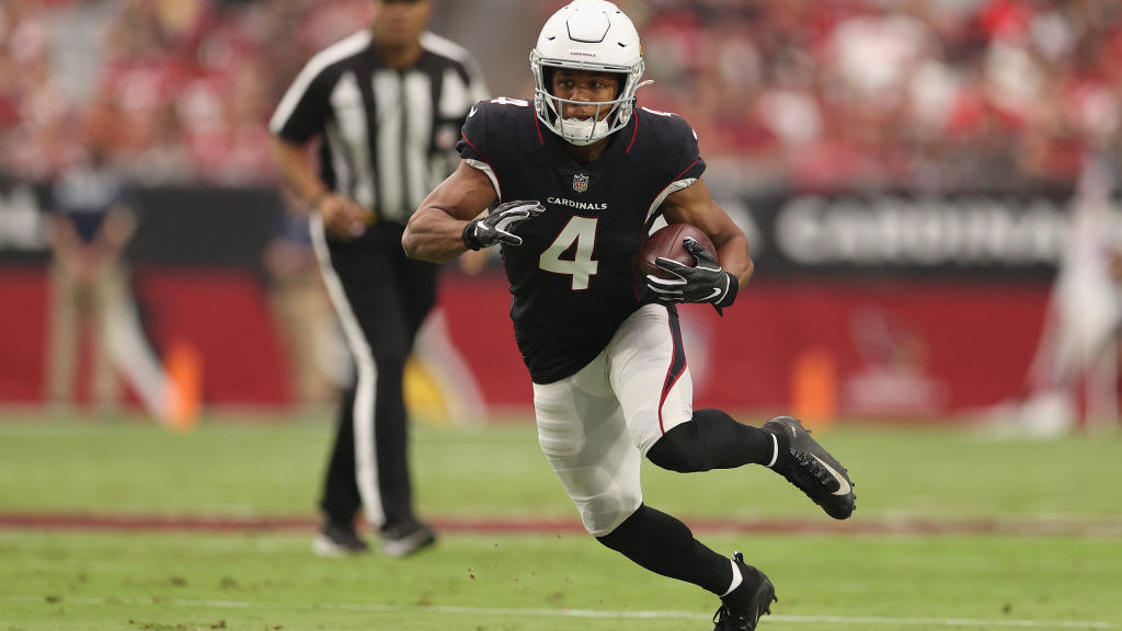 Wide receiver Rondale Moore #4 of the Arizona Cardinals runs with the football after a reception du...