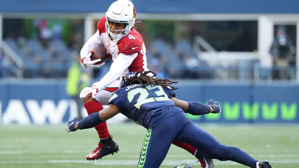 SEATTLE, WASHINGTON - NOVEMBER 21: Rondale Moore #4 of the Arizona Cardinals is tackled by Sidney J...