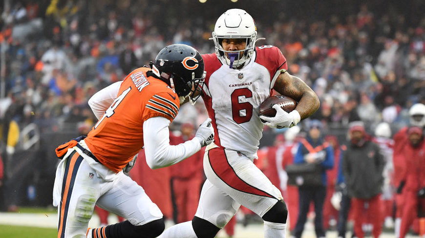 James Conner #6 of the Arizona Cardinals runs with the ball against Eddie Jackson #4 of the Chicago...