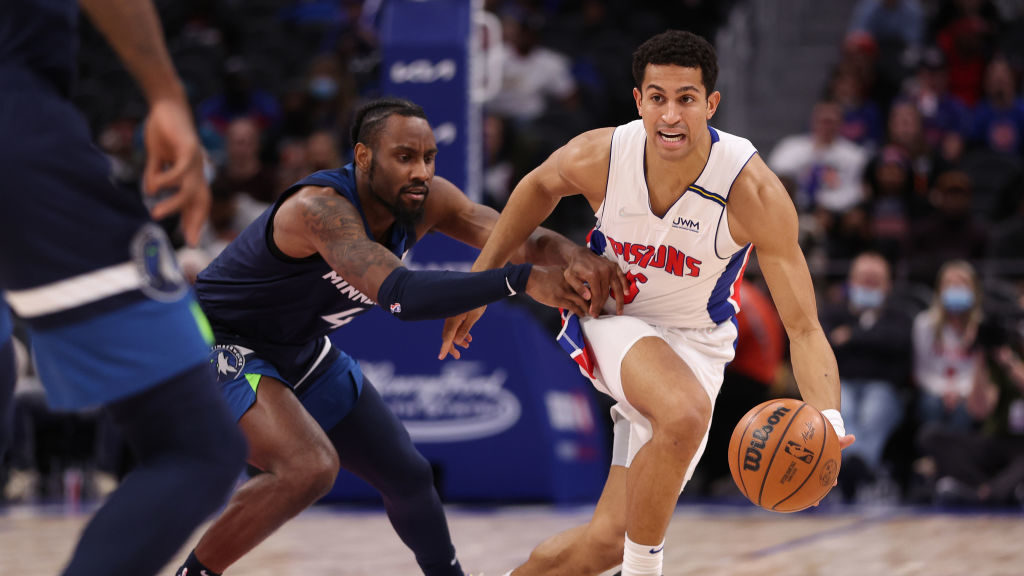 Frank Jackson #5 of the Detroit Pistons battles for the ball with Jaylen Nowell #4 of the Minnesota...