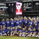 The Los Angeles Dodgers pose for a team photo after defeating the Arizona Diamondbacks in the MLB game at Chase Field on September 13, 2022 in Phoenix, Arizona. The Dodgers defeated the Diamondbacks 4-0 to clinch the National League West division. ˆ (Photo by Christian Petersen/Getty Images)