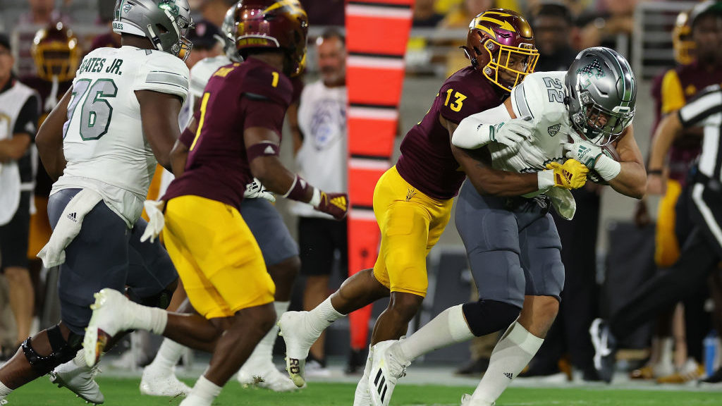 Keon Markham #13 of the Arizona State Sun Devils makes a tackle during the second half of the NCAAF...