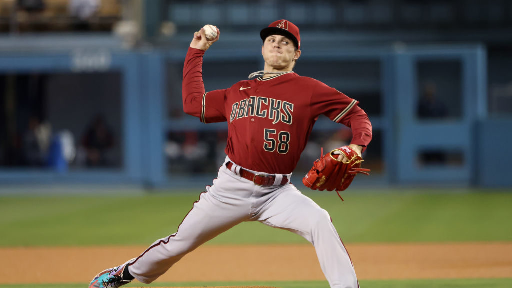 Drey Jameson #58 of the Arizona Diamondbacks delivers a pitch during the first inning against the L...
