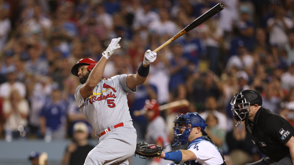 Albert Pujols #5 of the St. Louis Cardinals hits career homerun 700 in front of Will Smith #16 of t...
