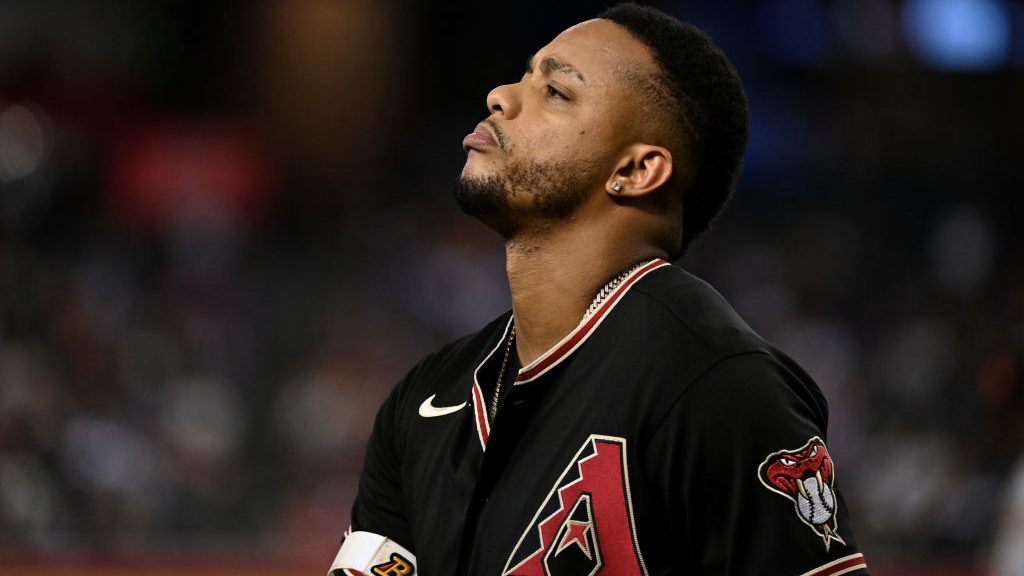 Ketel Marte #4 of the Arizona Diamondbacks walks back to the dugout after striking out against the ...