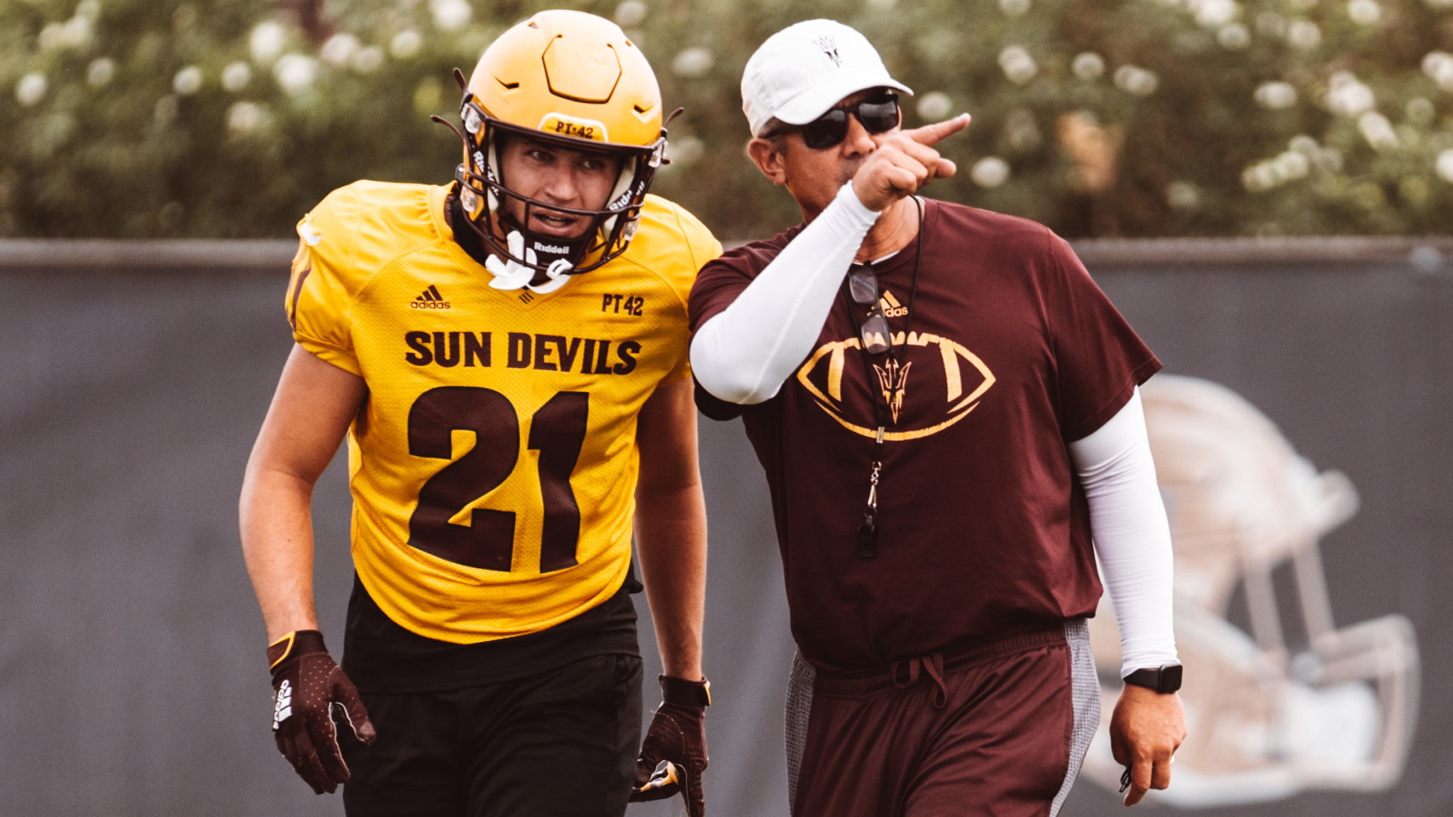 ASU interim head coach Shaun Aguano speaks with his player during practice on Tuesday, Sept. 20, 20...