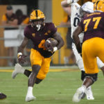 Arizona State running back Daniyel Ngata (4) carries against Northern Arizona during the first half of an NCAA college football game Thursday, Sept. 1, 2022, in Tempe, Ariz. (AP Photo/Rick Scuteri)