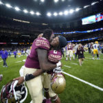 
              CORRECTS TO BLOCKED EXTRA POINT INSTEAD OF A BLOCKED FIELD GOAL - Florida State running back Treshaun Ward (8) celebrates with offensive lineman Darius Washington (76) after defeating LSU on a blocked extra point with no time remaining, in an NCAA college football game in New Orleans, Sunday, Sept. 4, 2022. Florida State won 24-23. (AP Photo/Gerald Herbert)
            