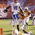 
              Florida quarterback Anthony Richardson (15) leaps into the end zone for a touchdown avoiding Tennessee defensive back Trevon Flowers (1) during the first half of an NCAA college football game Saturday, Sept. 24, 2022, in Knoxville, Tenn. (AP Photo/Wade Payne)
            