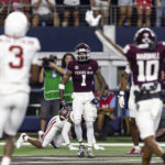 Texas A&M wide receiver Evan Stewart (1) celebrates his touchdown during the first half of the team's NCAA college football game against Arkansas on Saturday, Sept. 24, 2022, in Arlington, Texas. (AP Photo/Brandon Wade)