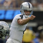 
              Las Vegas Raiders quarterback Derek Carr (4) gestures toward teammates during the first half of an NFL football game against the Los Angeles Chargers in Inglewood, Calif., Sunday, Sept. 11, 2022. (AP Photo/Gregory Bull)
            