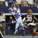 Dallas Cowboys wide receiver Noah Brown (85) hauls in a touchdown in front of Cincinnati Bengals safety Jessie Bates III (30) during the first half of an NFL football game Sunday, Sept. 18, 2022, in Arlington, Tx. (AP Photo/Ron Jenkins)