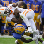 
              Pittsburgh defensive back Brandon Hill (9) tackles Tennessee quarterback Hendon Hooker (5) as he scrambles during the first half of an NCAA college football game, Saturday, Sept. 10, 2022, in Pittsburgh. (AP Photo/Keith Srakocic)
            