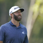 
              Dustin Johnson looks at the trees he hit his tee shot over on the 12 hole during the first round off the LIV Golf Invitational-Chicago tournament Friday, Sept. 16, 2022, in Sugar Grove, Ill. (AP Photo/Charles Rex Arbogast)
            